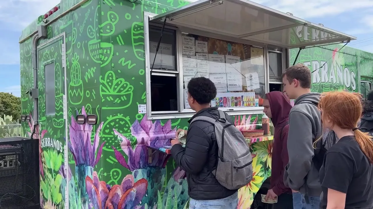 Customers ordering at the Serranos Taco Truck window in Oroville, California